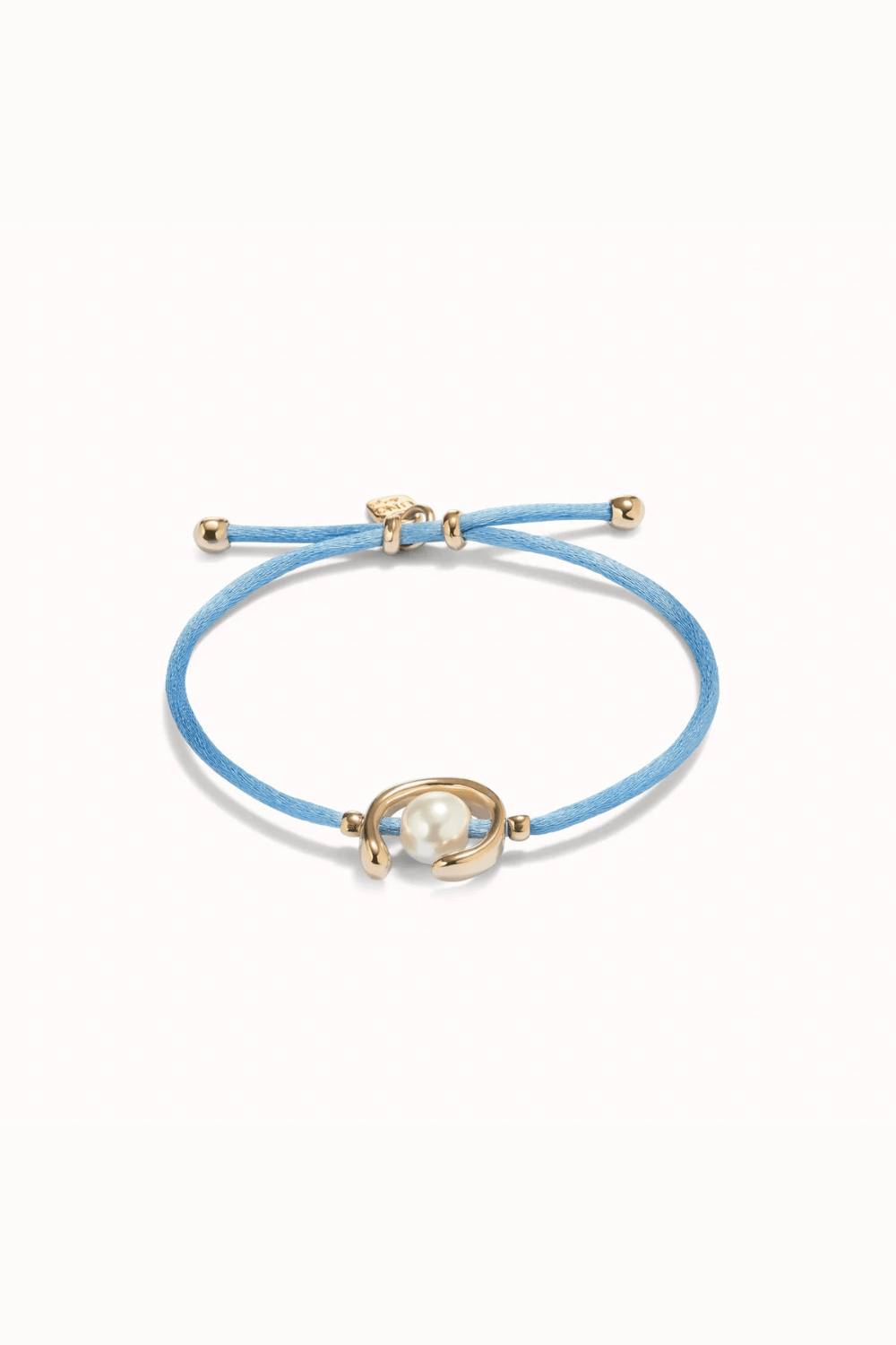 UNOde50 Bracelet 18K gold-plated blue thread bracelet with shell pearl accessory.