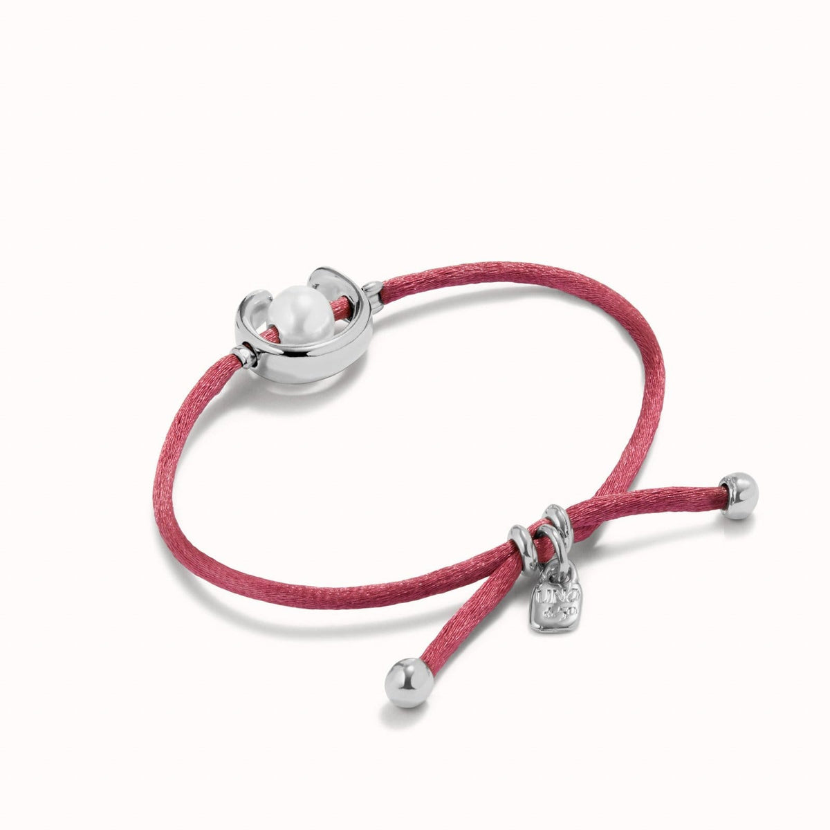 UNOde50 Bracelet Sterling silver-plated mauve thread bracelet with shell pearl accessory.